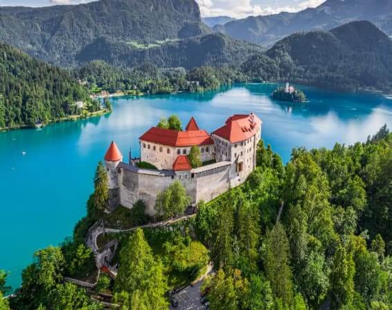 Ljubljana to Lake Bled tours group at Bled Castle. Bled lake accommodation & adventure tours