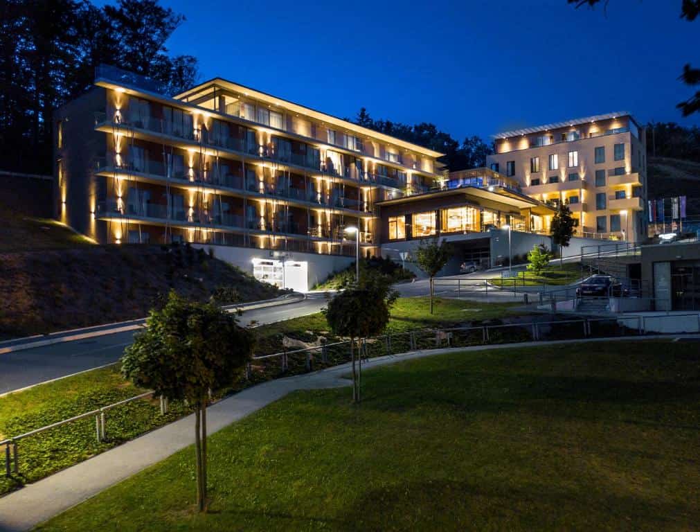 Atlantida Boutique Hotel elegant façade surrounded by lush greenery in Rogaška Slatina