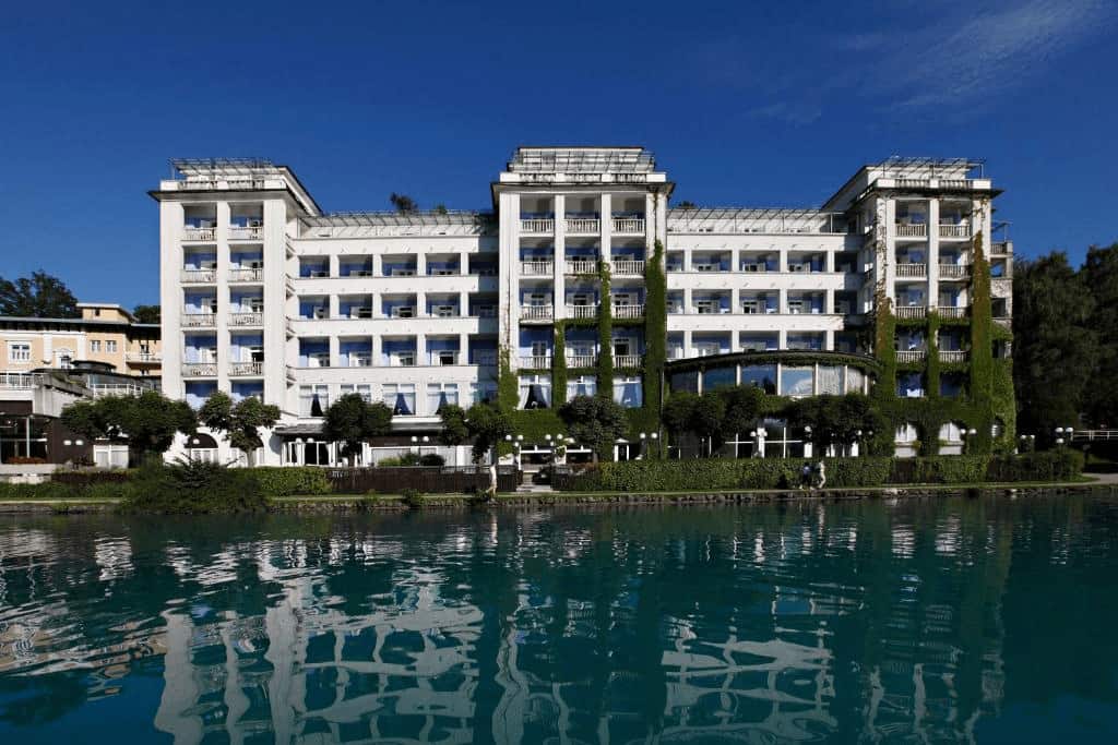 Grand Hotel Toplice elegant lakeside façade with Lake Bled and castle in the background