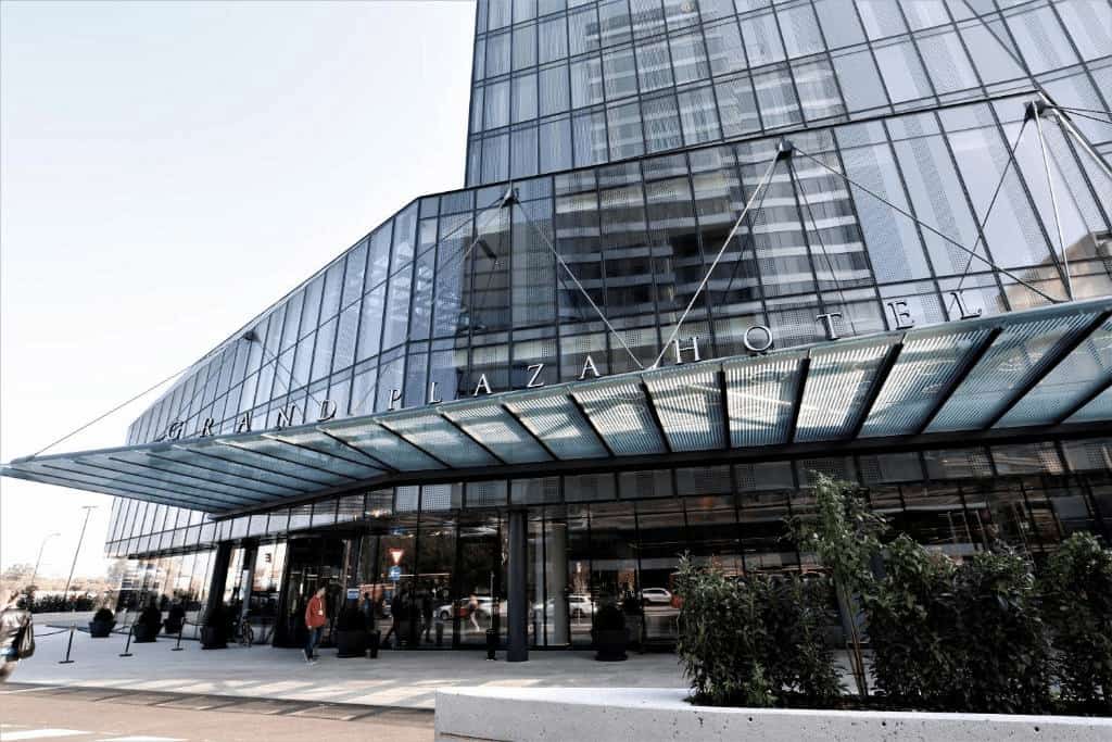 Grand Plaza Hotel & Congress Center contemporary exterior with rooftop terrace and city skyline