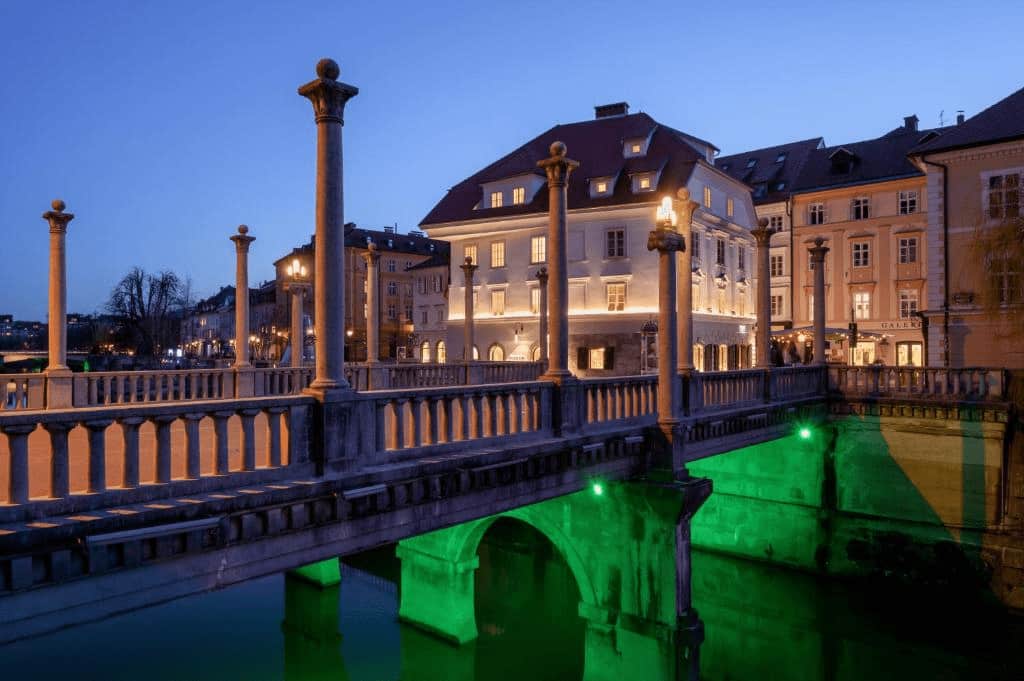 Zlata Ladjica Boutique Hotel charming riverside façade with leafy green walls in Ljubljana