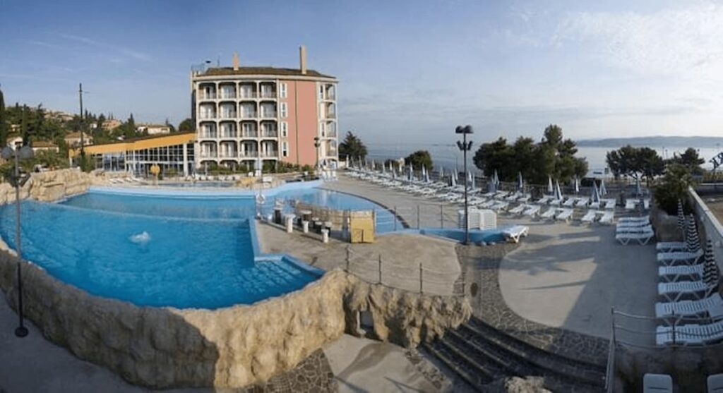 Best Stays Koper Slovenia. Swiming pool and hotel view.