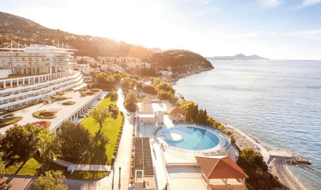 Slovenia vs Croatia luxury hotels. Sunny beach and hotel Sun Gardens Dubrovnik view.