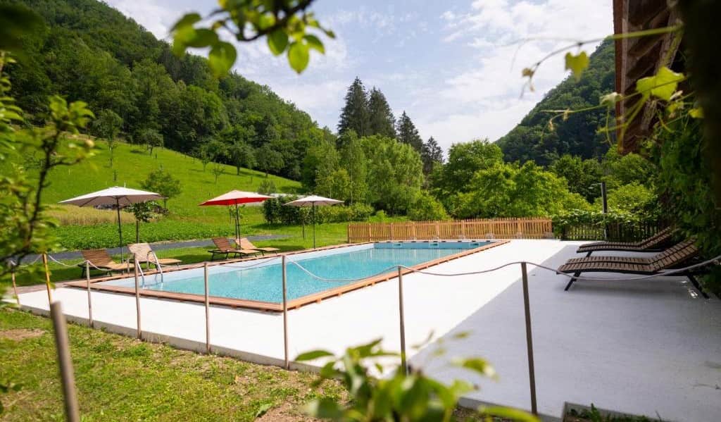 Luxury Farm Stays Slovenia. Swiming pool and landscape at the farm Zelinc.