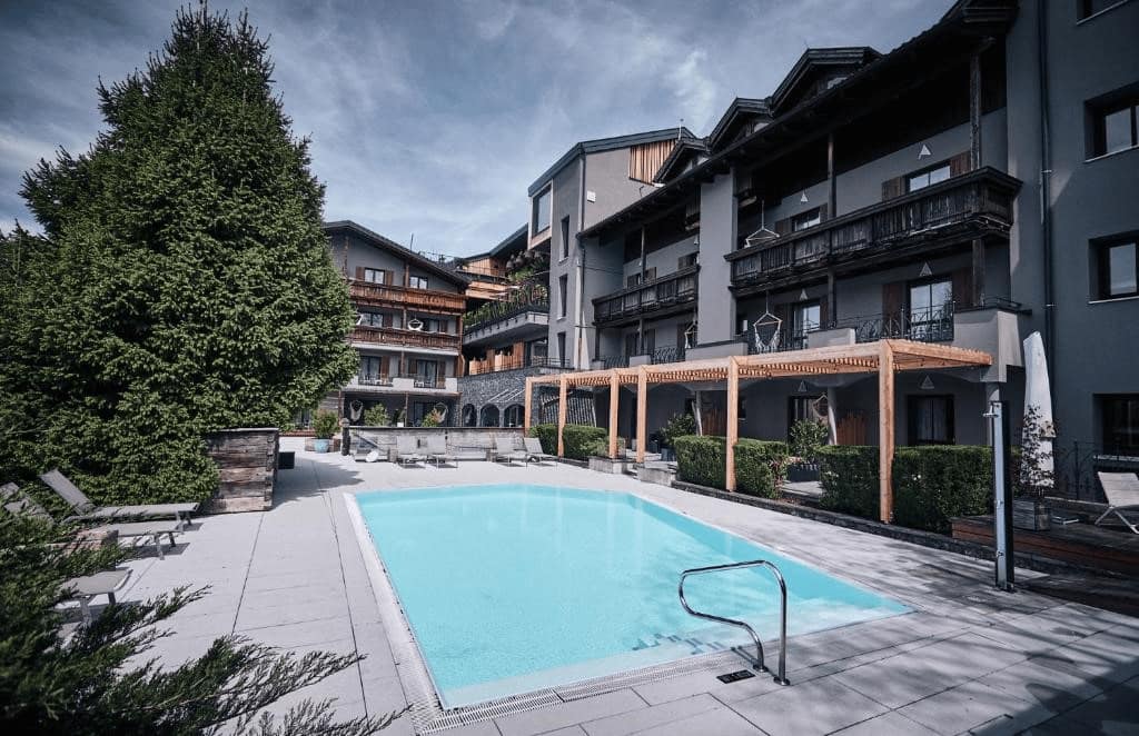best luxury hotels in Salzburg. Outward swiming pool behind the hotel.