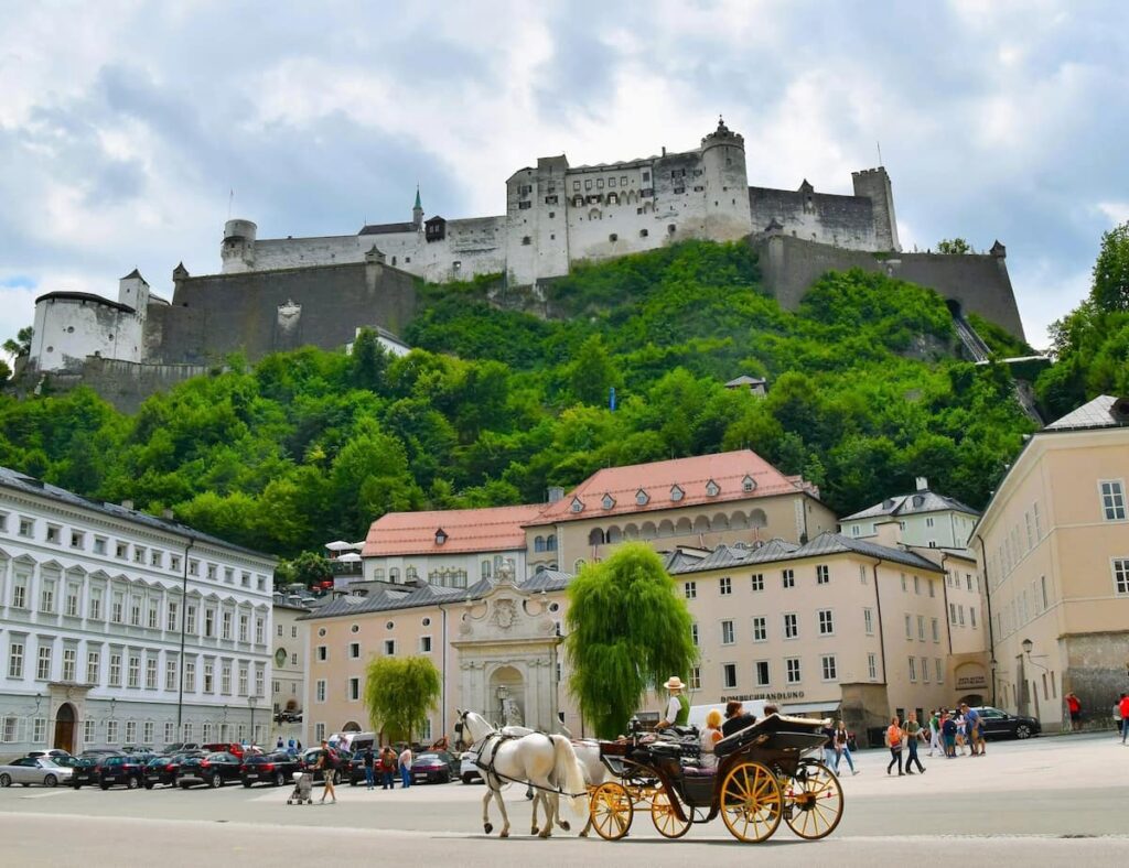 Boutique Luxury Hotels Salzburg Old Town. Stunning view of the hotel and castle behind on the hill.