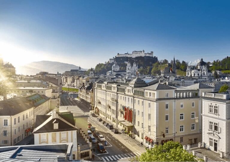 best luxury hotels in Salzburg. View from the hotel to the streets and castle.
