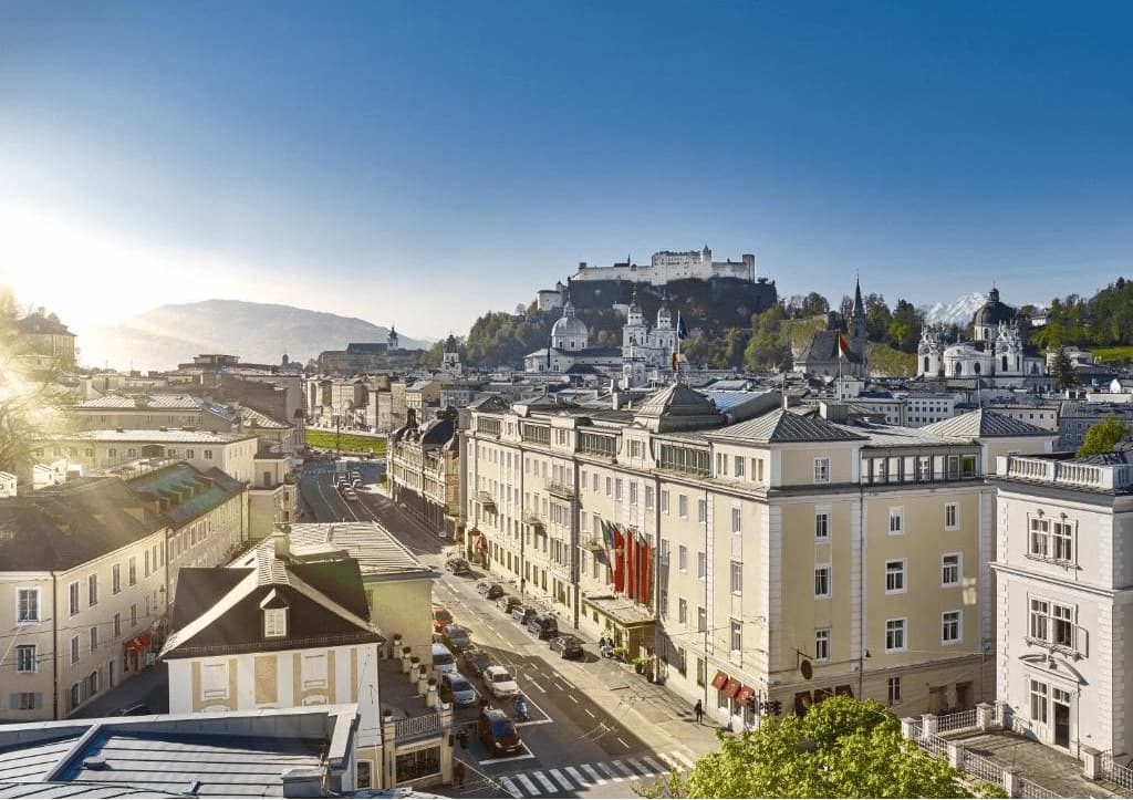 best luxury hotels in Salzburg. View from the hotel to the streets and castle.