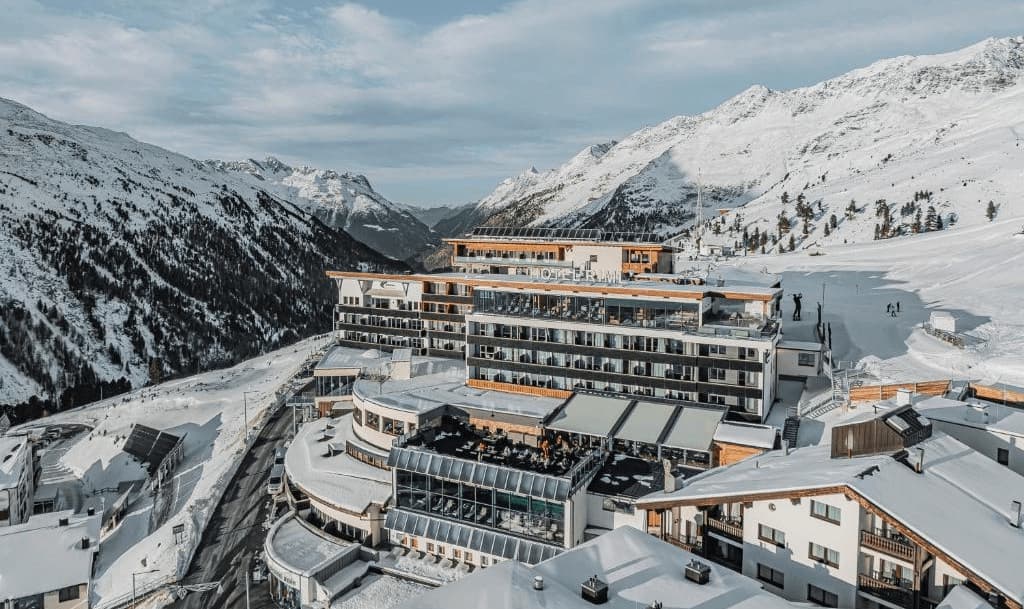 Luxury Ski-In Ski-Out Hotels Tyrol. Amazing hotel view and mountains covered in snow.