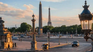 Panoramic view of Place de la Concorde in Paris with the Eiffel Tower in the distance, representing the historic architectural soul of the best historic hotels in France.