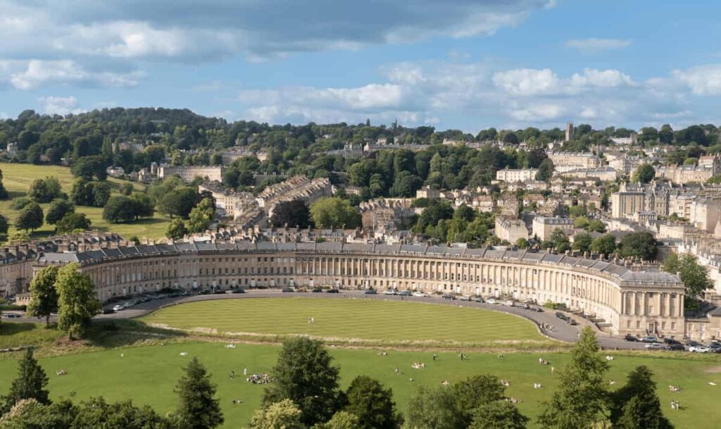 Best Hotels in Bath: The iconic curved Georgian stone facade and manicured lawns of The Royal Crescent Hotel & Spa, a UNESCO World Heritage landmark.