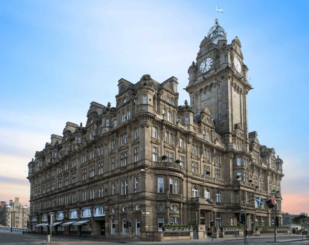 Best Hotels in Edinburgh: The iconic Victorian clock tower and grand facade of The Balmoral, a historic railway hotel landmark at No. 1 Princes Street.