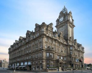 Best Hotels in Edinburgh: The iconic Victorian clock tower and grand facade of The Balmoral, a historic railway hotel landmark at No. 1 Princes Street.