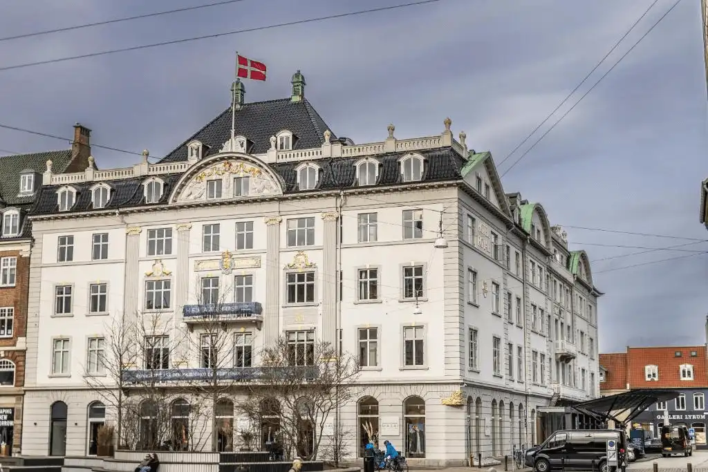 The 1838 neoclassical facade of Hotel Royal, the city's premier historical anchor and a definitive icon among the best hotels in Aarhus.