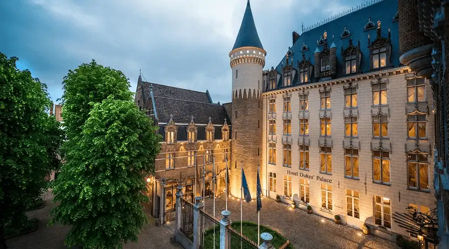 The 15th-century Gothic stone tower and original Burgundian palace facade of Dukes' Palace, the city's most significant royal landmark and the best hotels in Bruges.