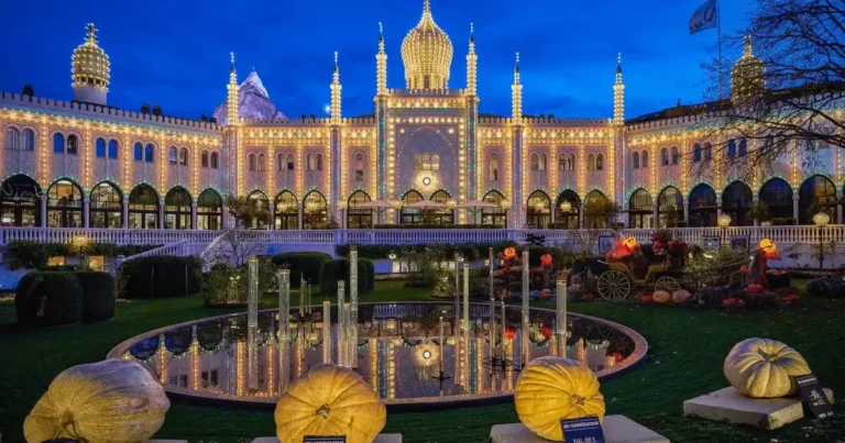 The illuminated Moorish-style palace facade of Nimb Hotel in Tivoli Gardens, highlighting its 1909 'Past Life' as a grand bazaar and banquet hall for the best hotels in Copenhagen register.