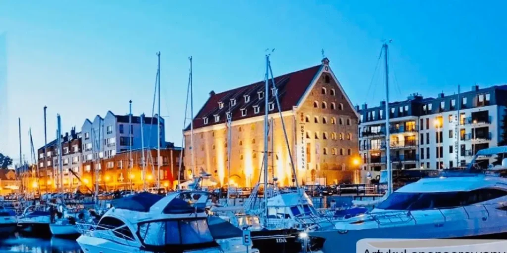 Best hotels in Gdansk: The restored 18th-century Baroque facade of Hotel Gdańsk Boutique overlooking the yacht marina and historic Szafarnia street.