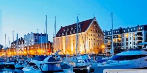 Best hotels in Gdansk: The restored 18th-century Baroque facade of Hotel Gdańsk Boutique overlooking the yacht marina and historic Szafarnia street.