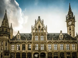 The iconic Neo-Gothic stone clock tower and fairy-tale facade of 1898 The Post, Ghent's most significant architectural landmark and the best hotels in Ghent.