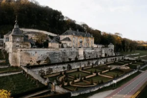 The symmetrical 17th-century marlstone facade and expansive baroque terraces of Château Neercanne, overlooking the Jeker Valley as the Netherlands' only terraced castle and one of the best hotels in Maastricht.