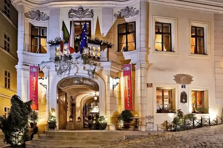 Best hotels in Prague: The historic facade of Alchymist Grand Hotel & Spa featuring the 16th-century Baroque architecture and the original polychrome relief of Our Lady of Loretto.