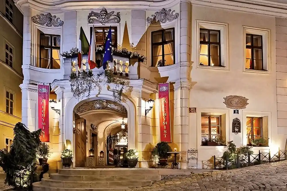 Best hotels in Prague: The historic facade of Alchymist Grand Hotel & Spa featuring the 16th-century Baroque architecture and the original polychrome relief of Our Lady of Loretto.