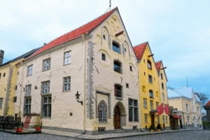 The Three Sisters is a centerpiece of the best hotels in Tallinn, featuring the 14th-century Gothic gables of the Big, Middle, and Small Sister houses and a 1651 carved oak portal.