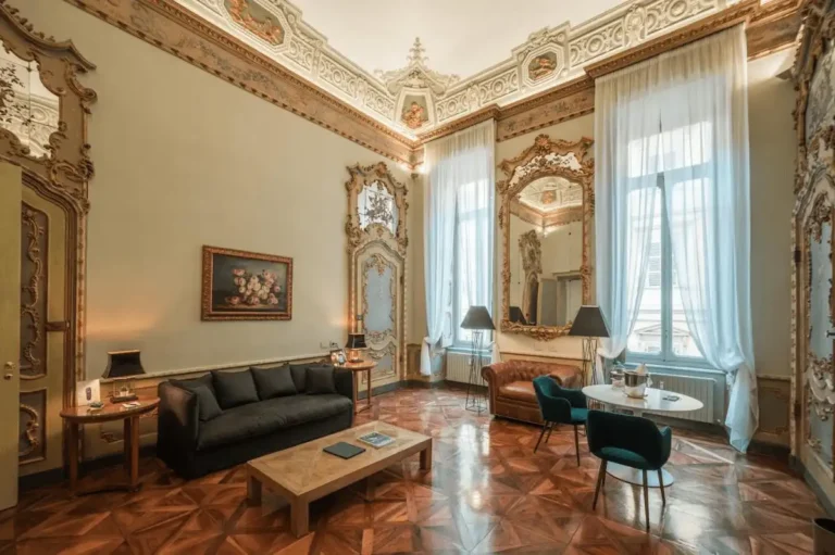 The 17th-century architectural details of Royal Palace Luxury Suites, located within the historic Savoy Royal Palace complex, one of the best hotels in Turin.