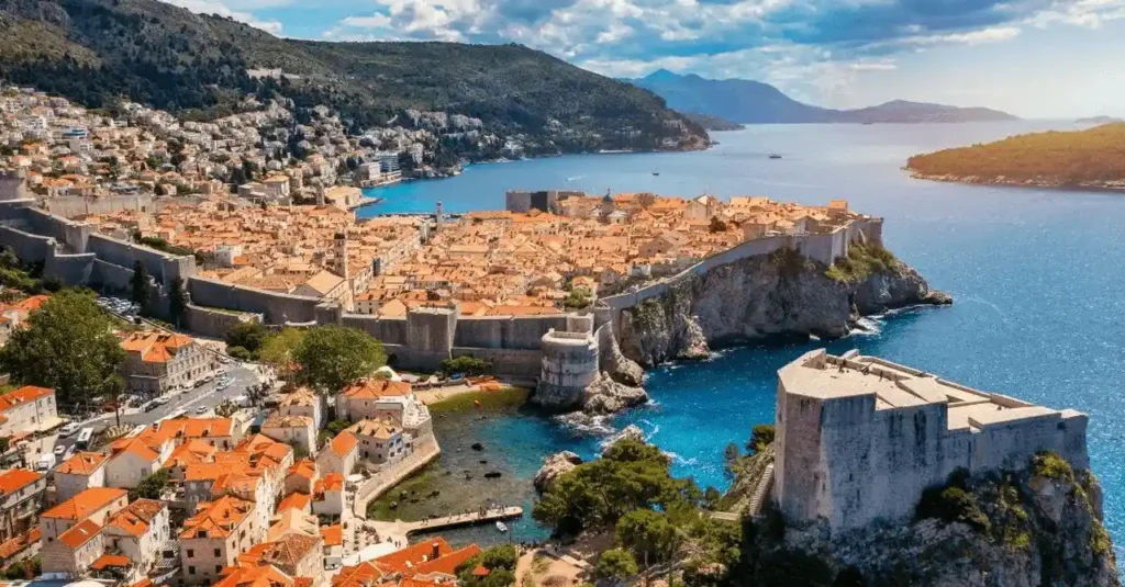 Best historic hotels in Croatia: An aerial view of the medieval Dubrovnik city walls and St. Lawrence Fortress, representing the country's aristocratic and imperial architectural heritage.