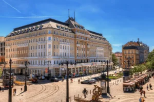 Best hotels in Bratislava: The neoclassical facade of the Radisson Blu Carlton Hotel, a 13th-century imperial landmark unified in 1837.