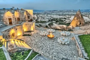 The meticulously restored 1990s facade and flagstone terrace of Museum Hotel, a "Living Museum" built upon ancient Hittite, Roman, and Seljuk ruins and a verified asset in the best hotels in Cappadocia landmark audit.