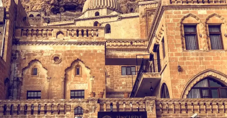 The 14th-century yellow limestone facade of Zinciriye Hotel, one of the best hotels in Merdin and a former medrese landmark.