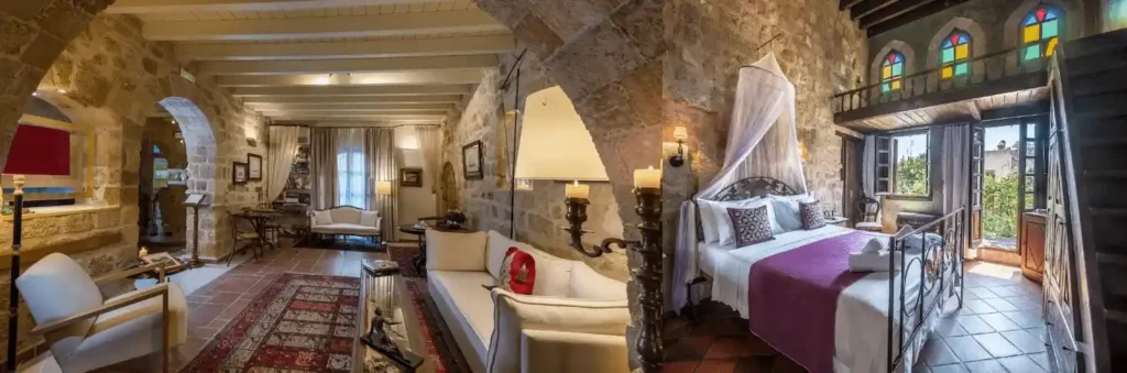 A side-by-side view of a medieval suite at Kókkini Porta Rossa and a 14th-century bedroom at S. Nikolis Historic Boutique Hotel, two of the best hotels in Rhodes.