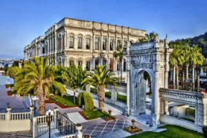 The 1867 imperial masonry facade and monumental marble water-gate of Çırağan Palace Kempinski Istanbul, a premier historical asset among the best hotels on Bosphorus Istanbul.