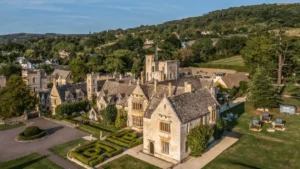 The 15th-century Cotswold stone masonry of Ellenborough Park, showing the historic manor facade and its architectural connection to the surrounding estate.