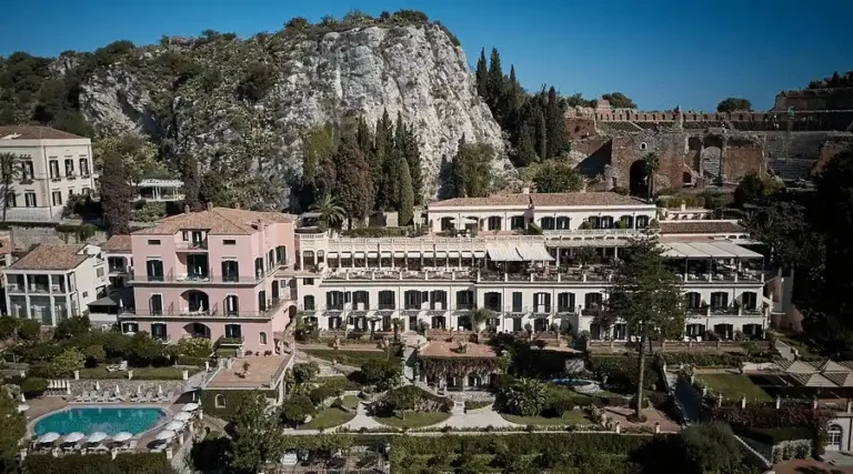 An aerial view of the Grand Hotel Timeo, A Belmond Hotel, Taormina, the city’s inaugural 1873 estate located directly adjacent to the Ancient Greek Theater with panoramic views of Mount Etna.