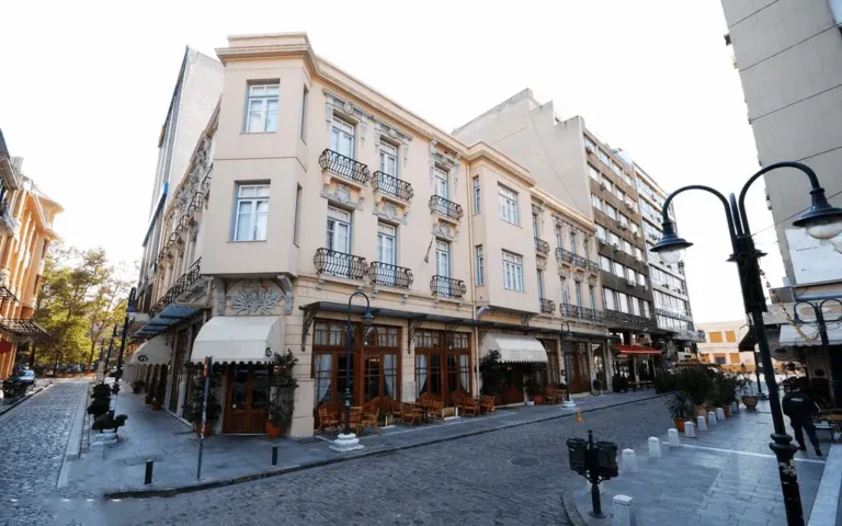 An exterior view of the Capsis Bristol Boutique Hotel in Thessaloniki, a historic 1860 landmark formerly serving as the Ottoman Post Office, featuring its meticulously restored architecture in the heart of the vibrant Ladadika district.