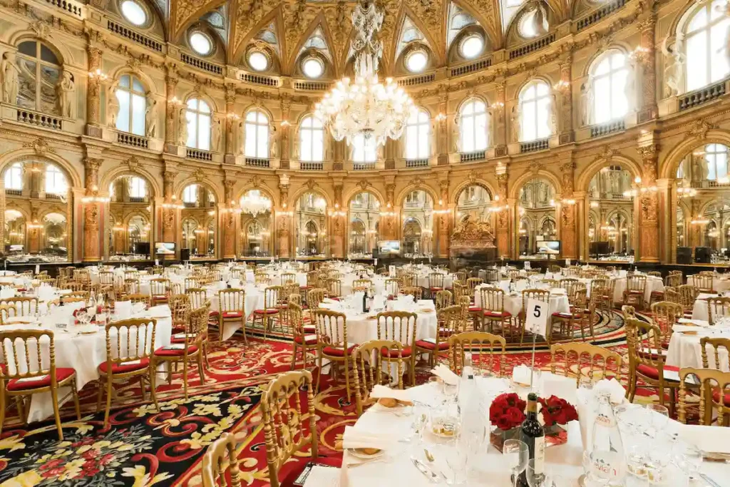 The opulent Salon Opéra ballroom at the InterContinental Paris Le Grand, a historic 1862 landmark, featuring its grand crystal chandeliers, gold-leaf detailing, and soaring domed ceiling designed by Charles Garnier.