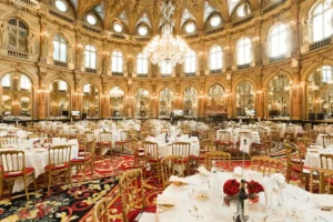 The opulent Salon Opéra ballroom at the InterContinental Paris Le Grand, a historic 1862 landmark, featuring its grand crystal chandeliers, gold-leaf detailing, and soaring domed ceiling designed by Charles Garnier.