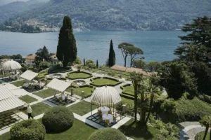 The historic facade and terraced gardens of Passalacqua on Lake Como, an 18th-century neoclassical villa built in 1787 where composer Vincenzo Bellini lived and wrote his most famous operas.