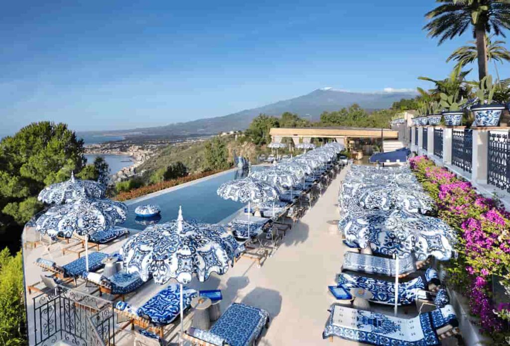 The infinity pool at San Domenico Palace Taormina, A Four Seasons Hotel, a luxury retreat housed in a restored 14th-century Dominican monastery with panoramic views of Mount Etna and the Ionian Sea.